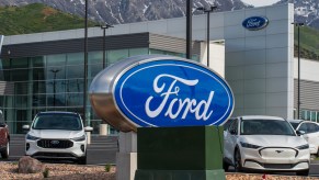 A Ford sign near electric cars