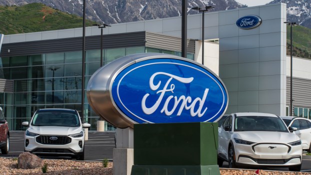 A Ford sign near electric cars