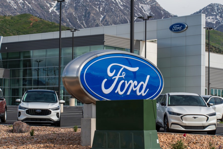 A Ford sign near electric cars