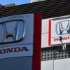 The "Honda" logo outside a Tokyo showroom inspecting cars for the recall