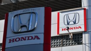The "Honda" logo outside a Tokyo showroom inspecting cars for the recall