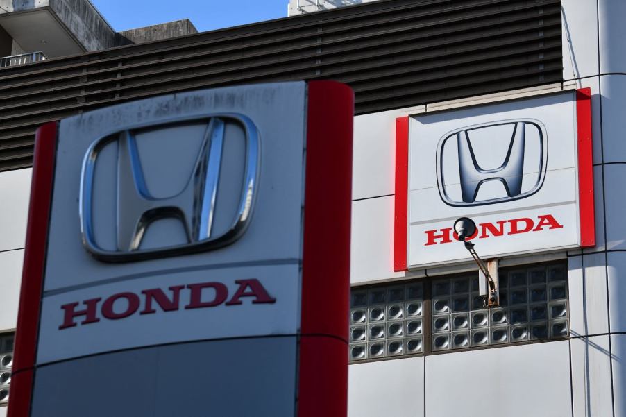 The "Honda" logo outside a Tokyo showroom inspecting cars for the recall