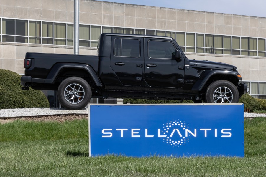A Jeep Gladiator near a Stellantis sign