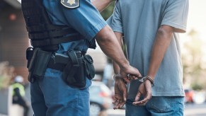 A police officer arresting a man