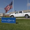 A Ram 1500 truck behind a Stellantis sign