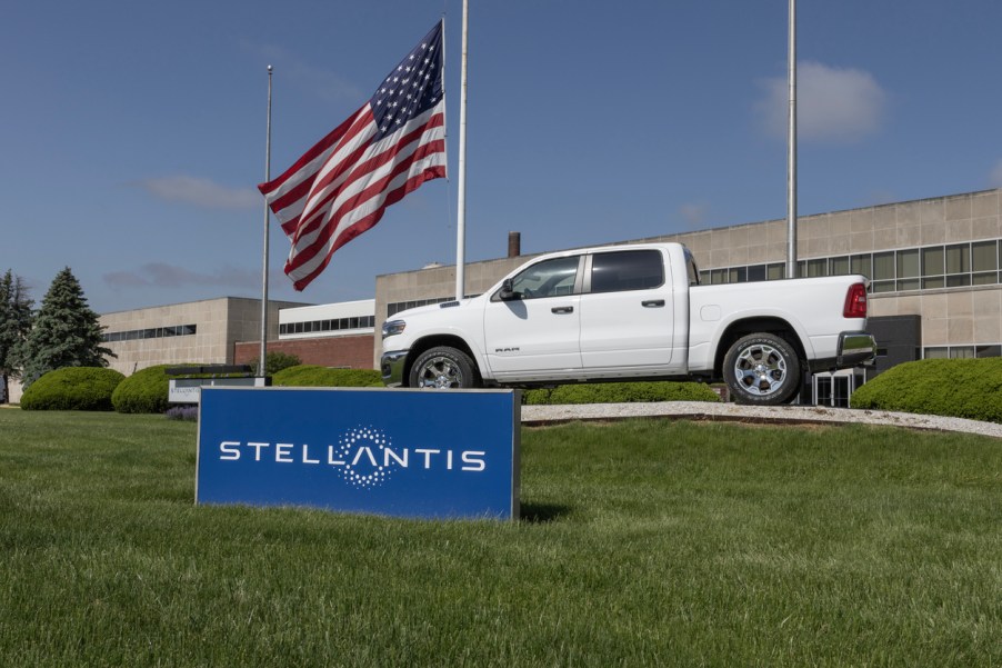 A Ram 1500 truck behind a Stellantis sign
