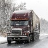 A semi-truck in the snow