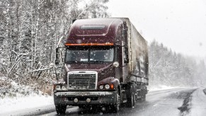 A semi-truck in the snow