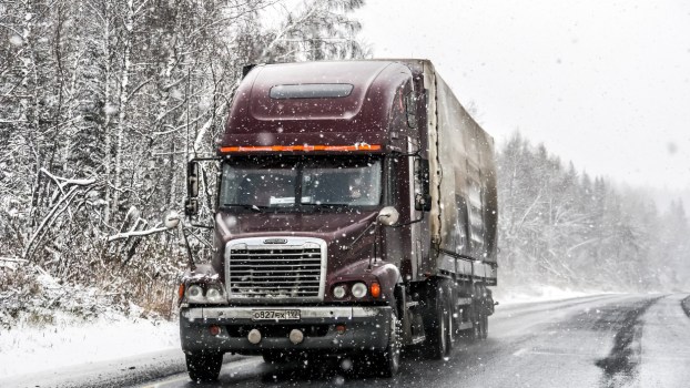 A semi-truck in the snow