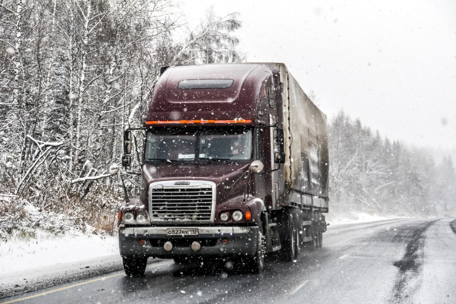 A semi-truck in the snow