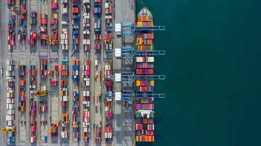 Aerial view of cargo ship loaded with shipping container on Detroit River