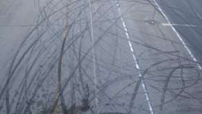 Skid marks on a highway after a street takeover.