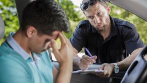 A police officer writing a traffic ticket