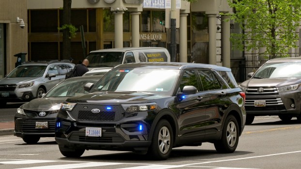 An unmarked police car with its lights on