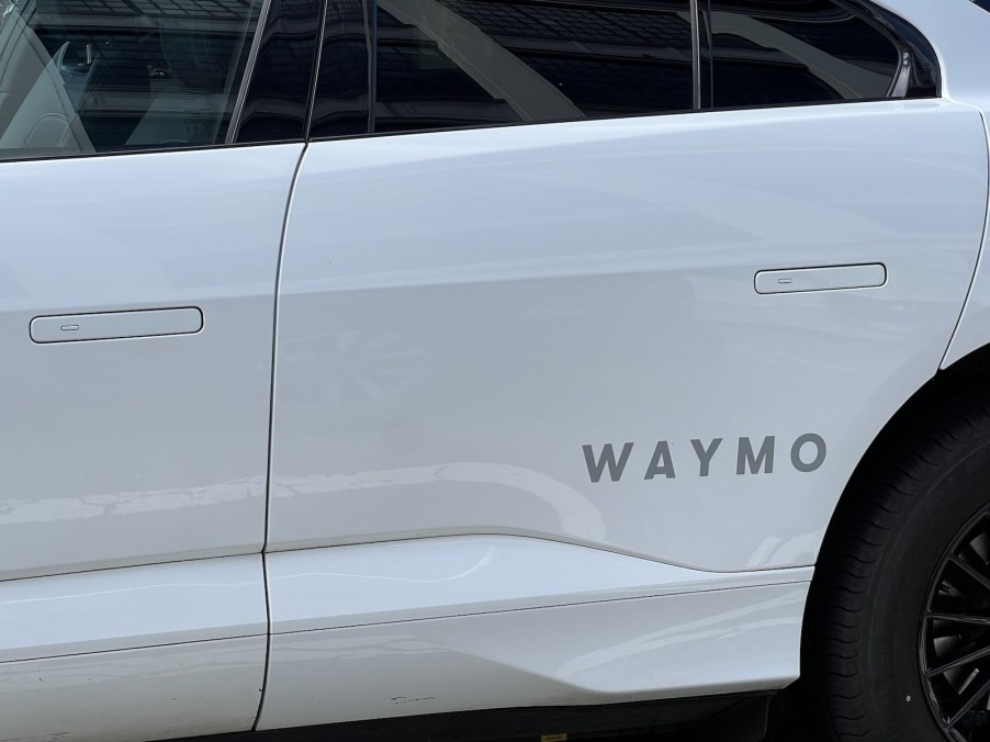 The Waymo logo on a Google self-driving taxi.