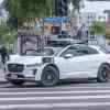 White Waymo taxi in a crosswalk in Los Angeles.