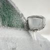 A car covered in ice in close view of right front