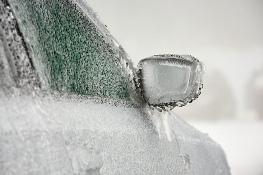A car covered in ice in close view of right front