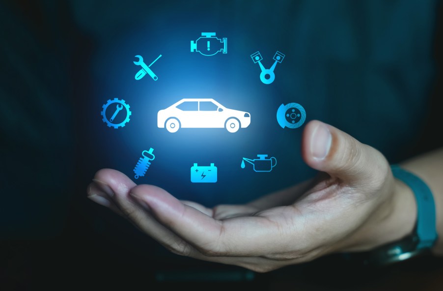 Illuminates vehicle maintenance light data icons floating in air above open hand