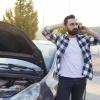 Driver on cell phone after experiencing a car breakdown