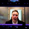 Tesla CEO Elon Musk speaks via video during the opening ceremony of 2023 World Artificial Intelligence Conference at Shanghai World Expo Exhibition and Convention Center on July 6, 2023 in Shanghai, China.