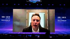 Tesla CEO Elon Musk speaks via video during the opening ceremony of 2023 World Artificial Intelligence Conference at Shanghai World Expo Exhibition and Convention Center on July 6, 2023 in Shanghai, China.