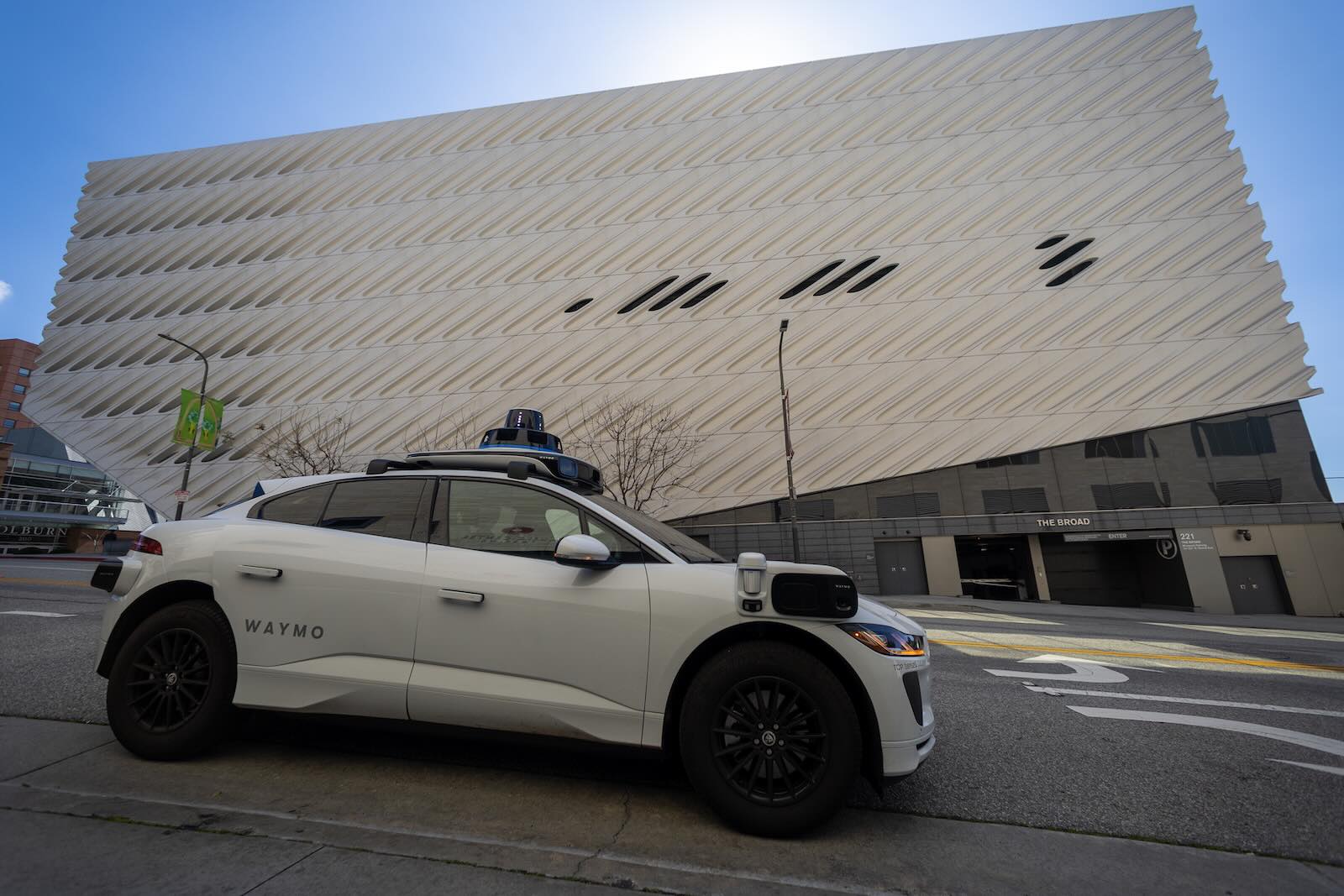 Closeup of a Waymo taxi driving on a San Francisco street.