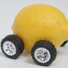 A lemon on wheels, depiction of a used car that's a money pit
