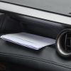 Mail sitting in a car's front dash compartment