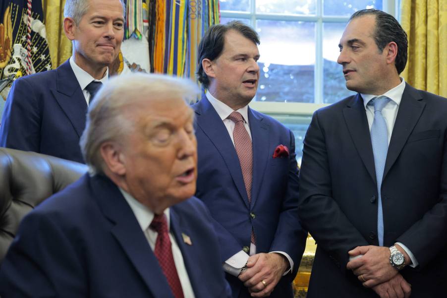 President Trump talks about kei cars as Sean Duffy, Jim Farley, and Antonio Filosa look on behind the White House desk