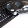 A black tow car on a computer keyboard