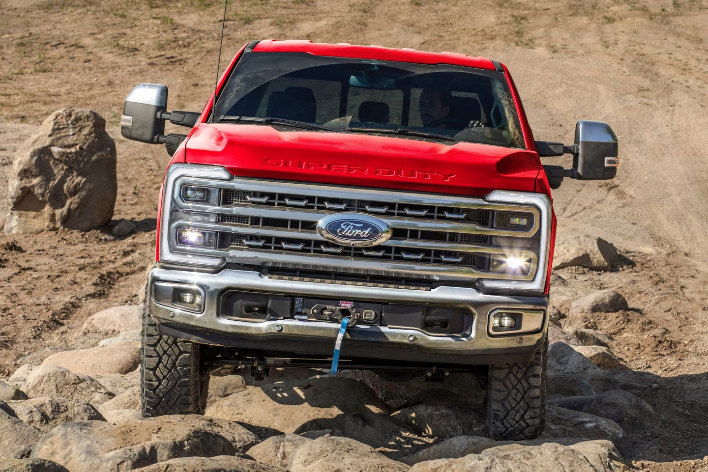 A 2025 Ford F-250 climbing over rocks