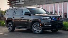 A 2025 Jeep grand Wagoneer Police Inceptor near a building