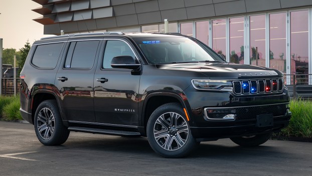 A 2025 Jeep grand Wagoneer Police Inceptor near a building