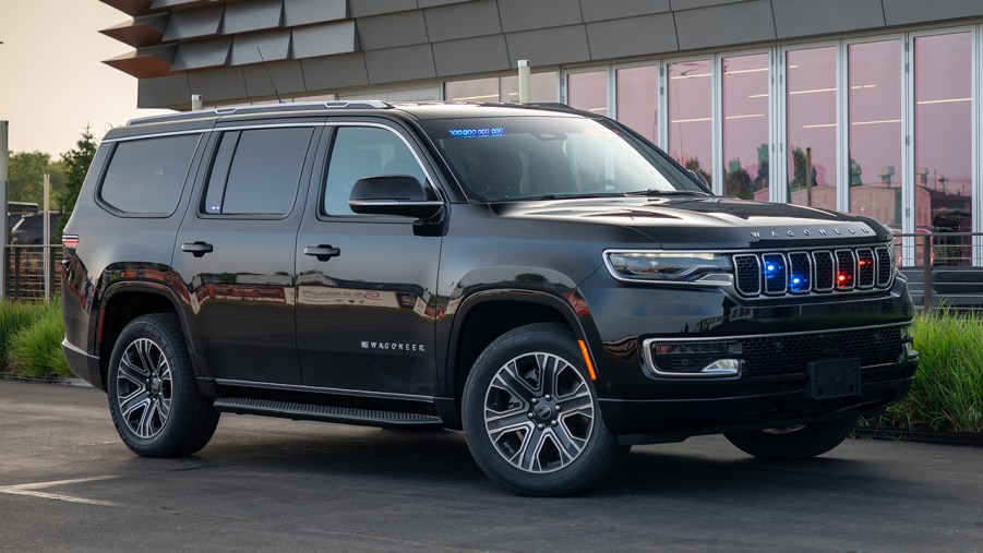 A 2025 Jeep grand Wagoneer Police Inceptor near a building