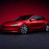 The 2025 Tesla Model 3 against a red background