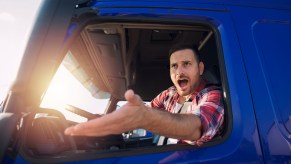 An angry truck driver in his cab