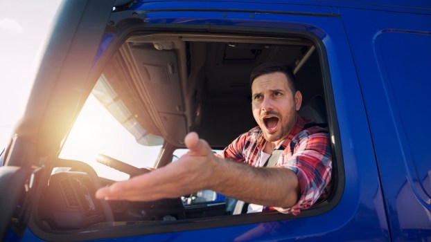 An angry truck driver in his cab