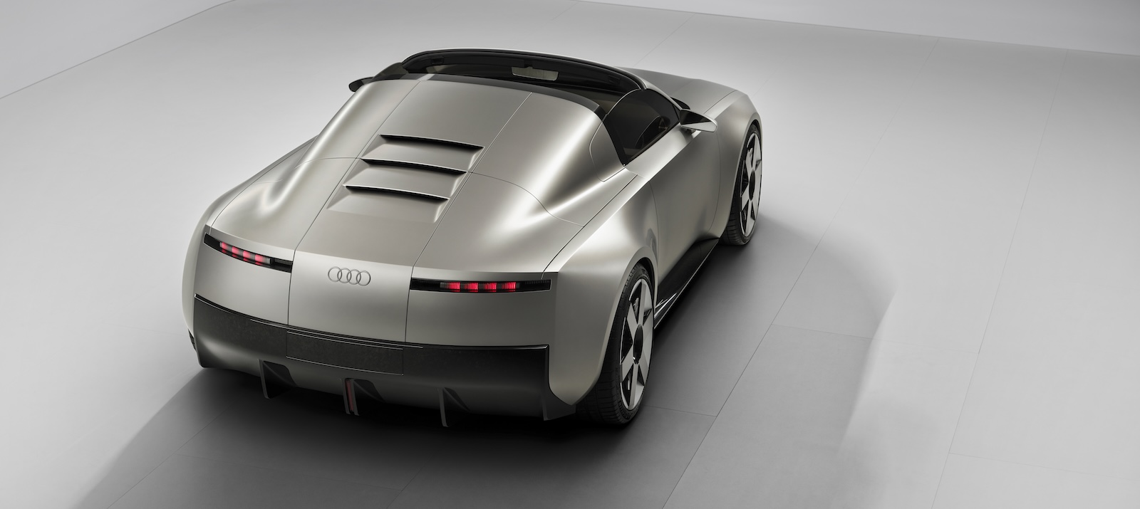 The rear of the T-top Audi C show car, parked on a white background.