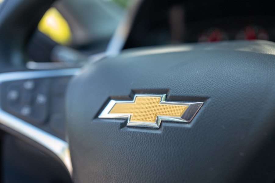 Bowtie logo on the steering wheel of used Chevy Bolt EV.