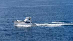 Florida charter captain's fishing boat sailing through the ocean.