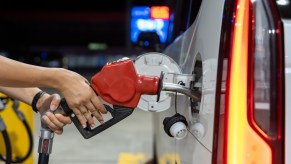 A person putting gas in an SUV
