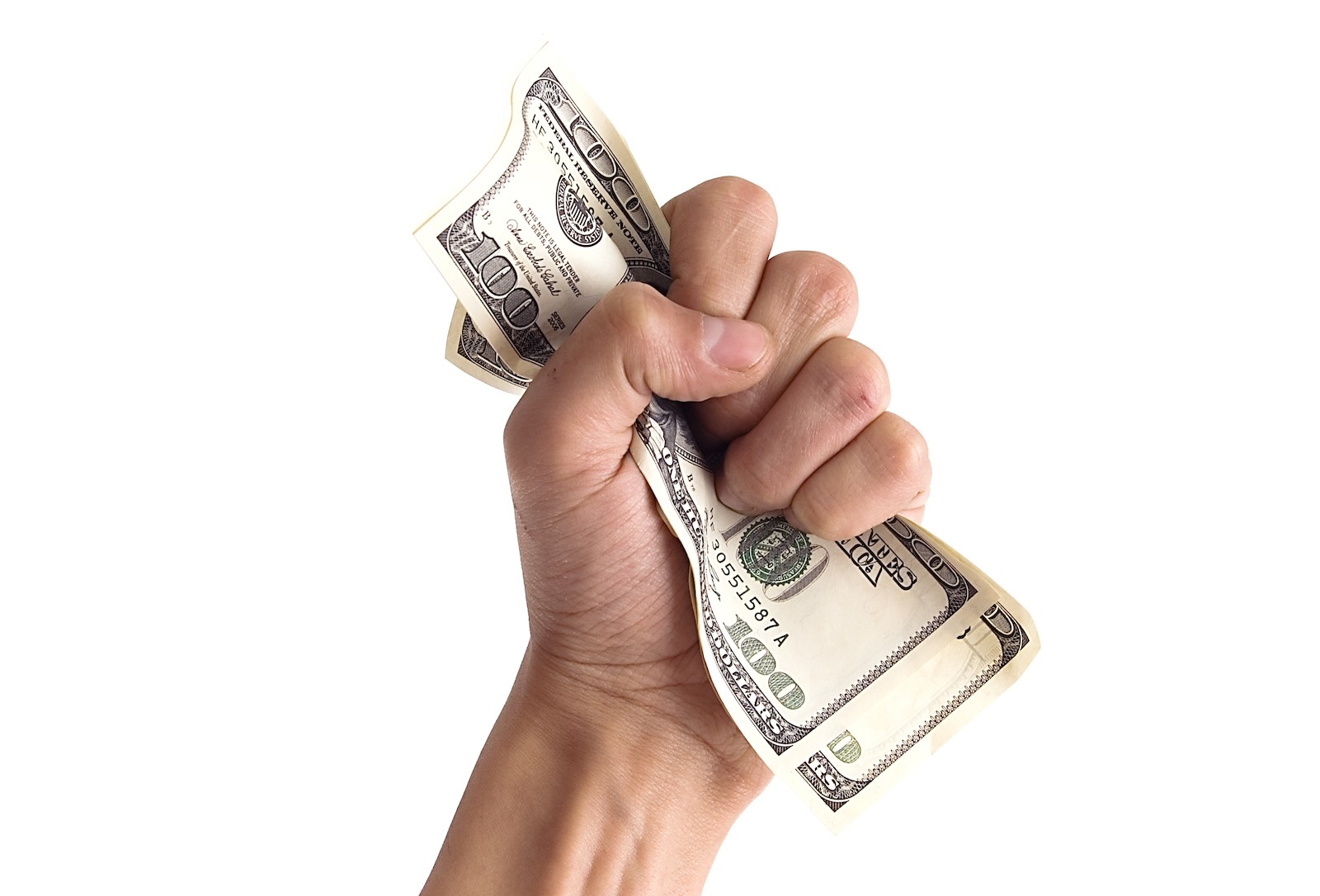 Fist grabbing hundred dollar bills on a white background.