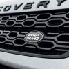 The Land Rover logo on a Discovery SUV grille.