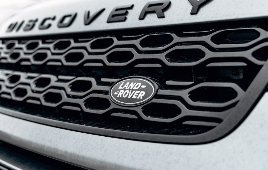 The Land Rover logo on a Discovery SUV grille.