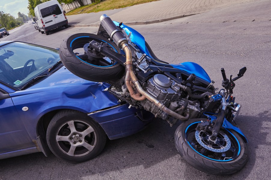 A car hitting a motorcycle