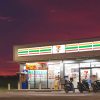 Row of motorcycles parked in front of 7-Eleven gas station and convenience store.