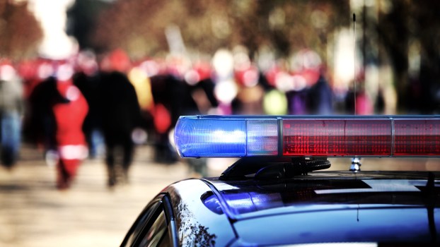 Police lights in front of a crowd