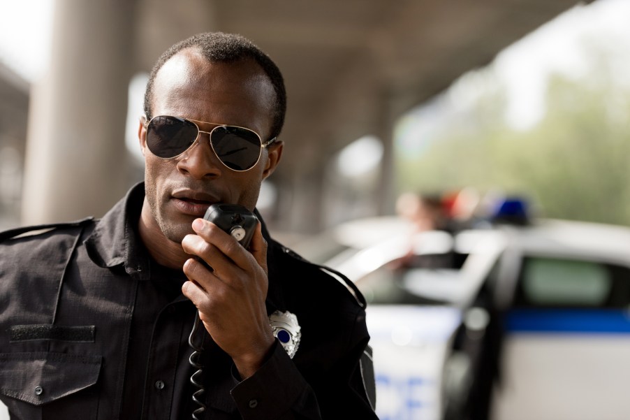 A police officer using a radio