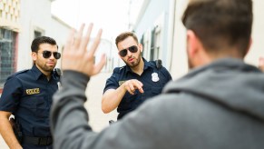 Police officers arresting a man